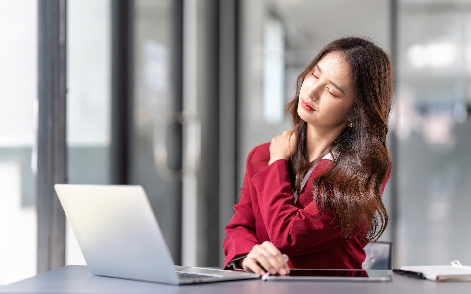 Tired fatigued business woman office worker feeling pain chronic discomfort injury hurt rubbing