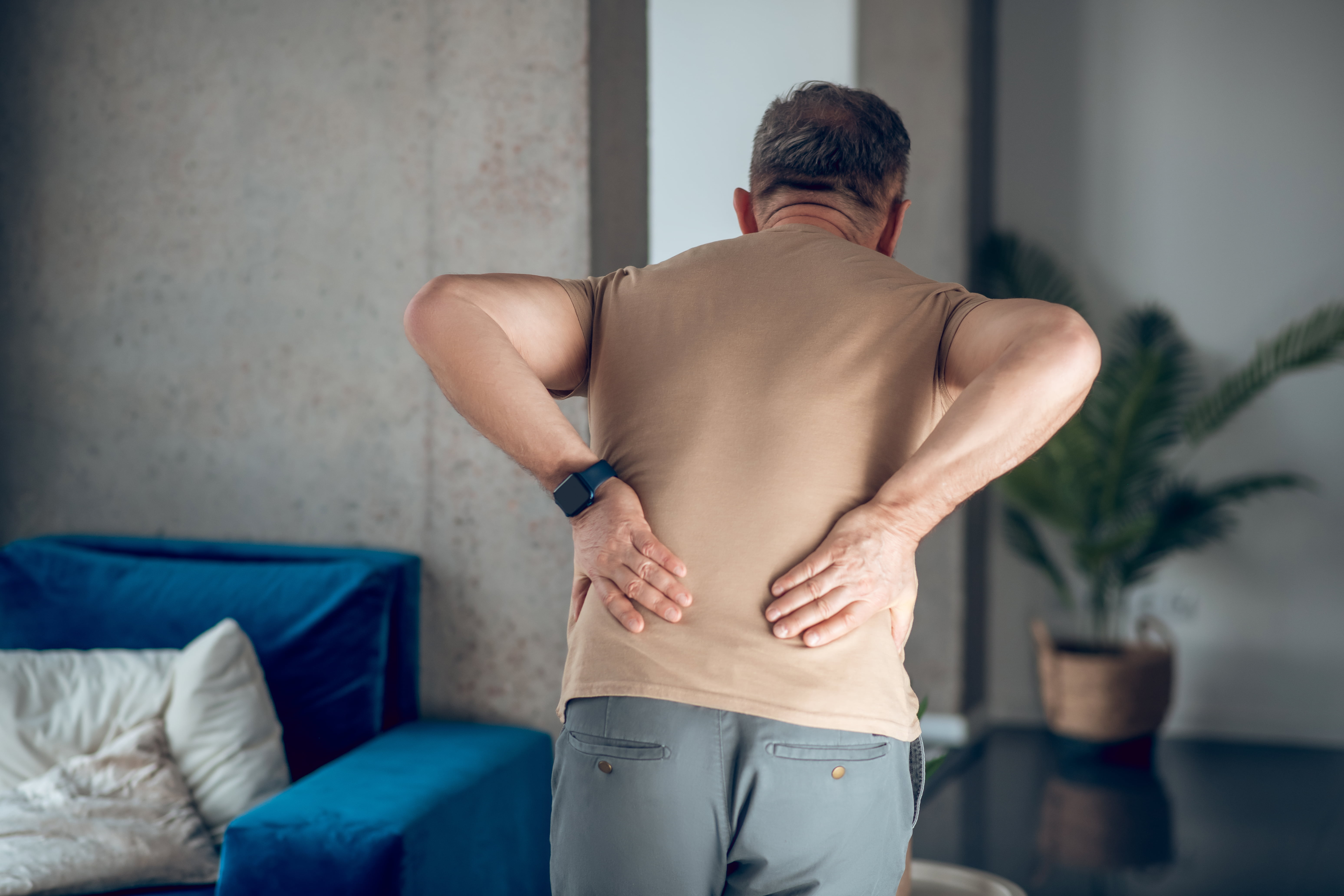 A man having pain in his lower back